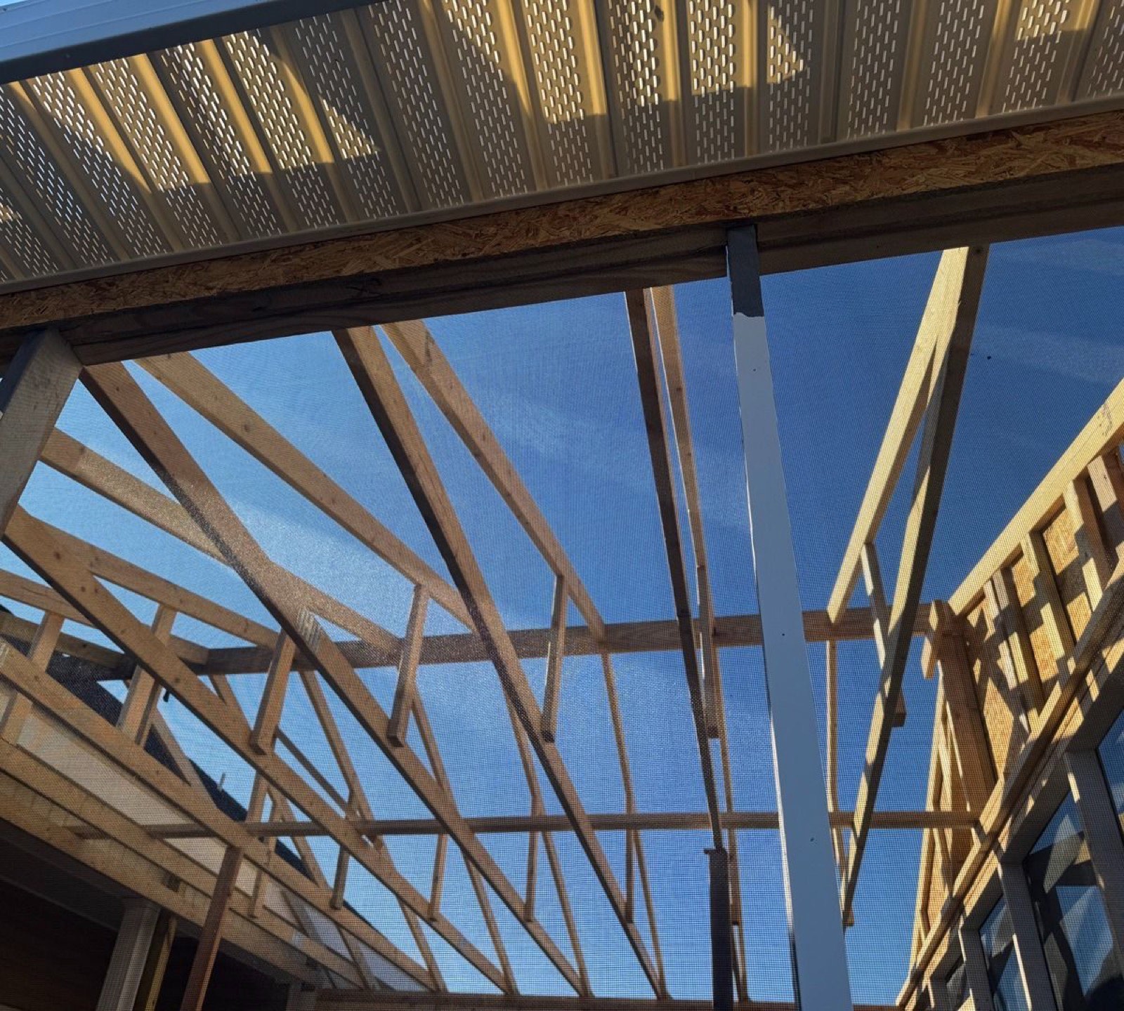 Residential roofing crew at work on a coastal NC home